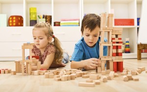 Kids playing with wooden blocks